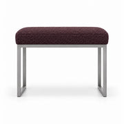 Bencivola Pedicure Footrest with deep plum brown fabric upholstery and stitched cushion edges, shown against white.