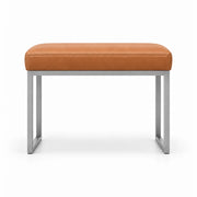 Bencivola Pedicure Footrest, its caramel tan leather top set above rectangular metal end supports with a slim metal frame.