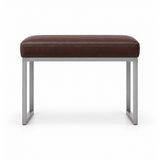 Bencivola Pedicure Footrest pairs a brown leather top with rectangular metal end supports and stitched cushion edges.