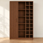 Kokovera wooden bookshelf in brown finish with open shelves, varied cubbies, and a tall vertically fluted closed section.