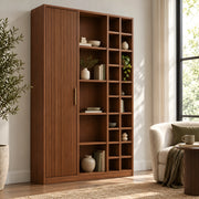 Kokovera bookshelf close-up highlighting its brown finish, mixed-size compartments, and vertical fluting on the cabinet.
