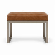 Tan brown leather upholstery tops the Lupendri Pedicure Footrest, above open sled-style legs and a taupe metal frame.