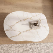 Cloud Curve Solid Surface Gold Coffee Table with a wavy organic shape, white marble-like surface featuring gold veining, placed on light wood flooring.