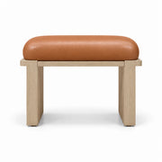Caramel tan leather covers the padded top of the Vendisora Pedicure Footrest, paired with a narrow wood front rail.