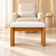 Addelino Wooden Frame Pedicure Footrest before a cream salon chair, featuring a warm wood base and a broad wooden apron.