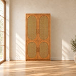 Alvarario 2 Door Wooden Cane Wardrobe, detailed with a narrow wooden case and a warm wood finish against a bedroom wall.