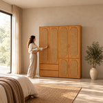 Alvarario 4 Door Wooden Cane Wardrobe with a woman at the front of the wardrobe, featuring rounded cane door inserts.