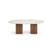 Arvizta Marble Top 6-Seater Dining Table shown with an oval marble top, a long dining surface and pale surface veining.