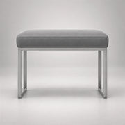 Bencivola Pedicure Footrest, detailed with rectangular end supports and a grey stitched cushion against a grey backdrop.