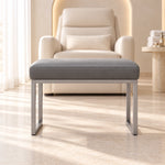 Bencivola Pedicure Footrest featuring rectangular end supports alongside a grey stitched cushion in a softly lit salon.