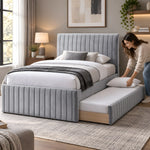 Bexylona Grey Kids Trundle Bed, wood-tone underbed trim and a matching footboard, with bedding being arranged on the trundle.
