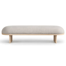 Alternate view of Calmovy Beige Upholstered Bench, showing soft cushioned seat and rounded profile in a modern home setting.