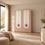 Carmeniso 4 Door Pink and Cream Wardrobe, showing circular door handles and long vertical accents against a bedroom wall.