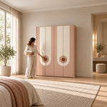 Carmeniso 4 Door Pink and Cream Wardrobe beside a woman reaching toward the door, showing a straight full-height frame.