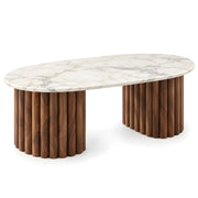 Alternate view of Cavifluta Marble Coffee Table, showing oval top and twin fluted pedestals in a balanced home interior.