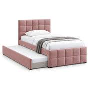 Cemaliso Dusty Pink Kids Trundle Bed: dusty pink upholstery, square padded panels and white bedding against a white backdrop.