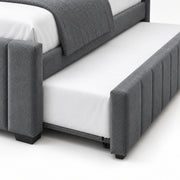 Chikilora Dark Grey Kids Trundle Bed detail showing vertical channels on the pull-out front, small wheels and white bedding.