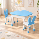 Clourabby Blue Cloud Kids Table with 2 Chairs, detailed with white chair seats and blue-tipped feet beside a playroom window.