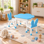 Clourabby Blue Cloud Kids Table with 2 Chairs, showing blue-tipped feet and white chair seats beside a playroom window.