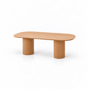 Alternate view of Colioaky Wooden Oval 6-Seater Dining Table, showing oval top with rounded ends in a modern home setting.
