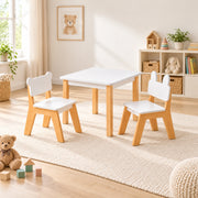 Costzony White Kids Table with 2 Chairs beside a playroom window: a bear-ear chair, a bunny-ear chair and natural wood legs.