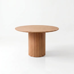 Alternate view of Dainia Modern Wooden Dining Table, showing round top and slatted pedestal base in a modern home setting.