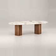 Delosita Marble Top 6-Seater Dining Table featuring warm wood grain alongside two angular block legs against a grey backdrop.