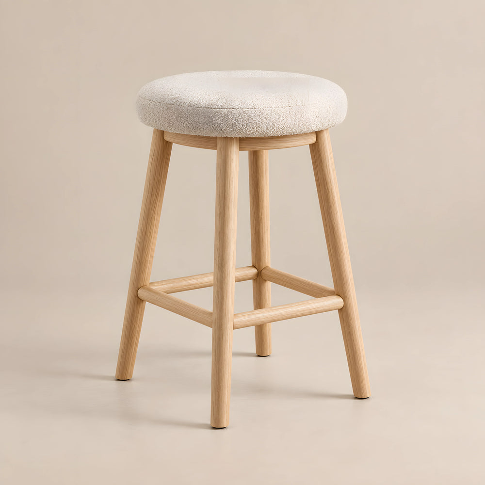 Digolna Wooden Counter Stool product photo showing round cushioned seat and soft upholstery in a clean studio setting.