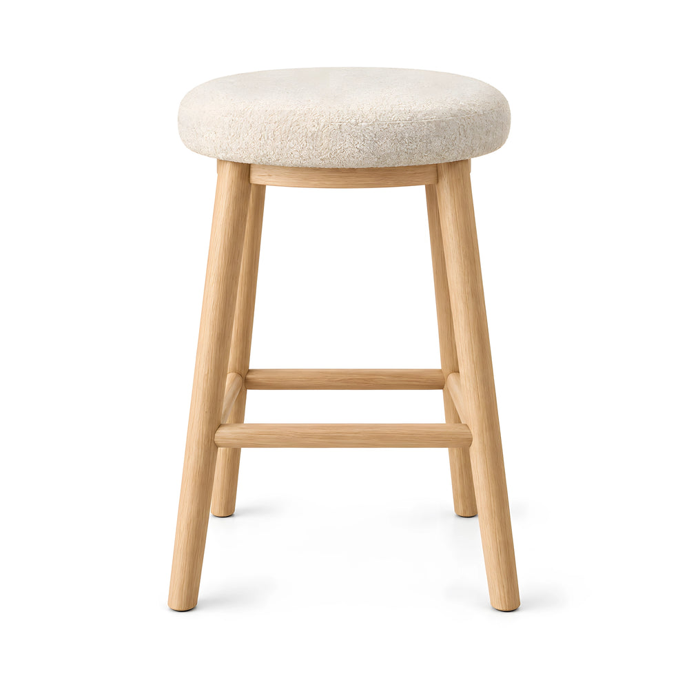Alternate view of Digolna Wooden Counter Stool, showing round cushioned seat, soft upholstery, and four-leg wooden frame.