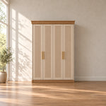 Dolbarino 4 Fluted Door Wooden Wardrobe, with brass-tone pulls and four vertically fluted doors in a furnished bedroom.
