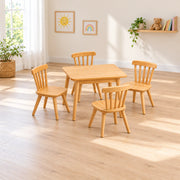 Dukyshola Wooden Kids Table with 4 Chairs combines spindle-back chairs with splayed round legs beside a playroom window.