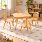 Dukyshola Wooden Kids Table with 4 Chairs pairs spindle-back chairs with a natural wood finish beside a playroom window.