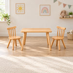 Dukyshola Wooden Kids Table with 2 Chairs, showing splayed round legs and circular wooden seats beside a playroom window.