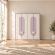 Elegitora Lavender 4 Door Wardrobe brings together circular door pulls and rounded arch details beside a bedroom window.