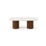 Elgenalia Marble Top 6-Seater Dining Table: two fluted cylindrical legs, a pale veined surface and a rounded marble top.