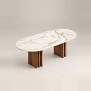 Ezzimora Marble Top 6-Seater Dining Table pairs an oval marble top with a rounded tabletop edge against a grey backdrop.