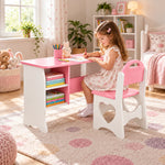 Faraliso Pink Kids Study Desk with Chair: white shaped side panels beside a child seated at the table on a patterned rug.