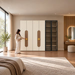 Furnilora 6 Door Wardrobe with Storage Cabinet beside a woman reaching toward the door, showing elongated accent panels.