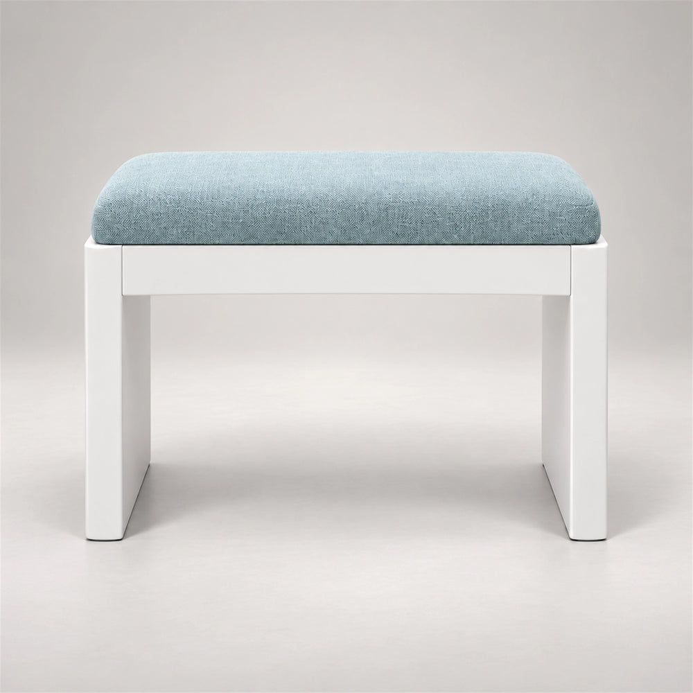 Harteslo Pedicure Footrest against a grey backdrop: a pale blue cushion, a rounded padded top and straight end supports.