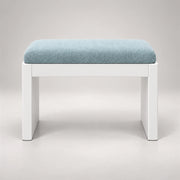 Harteslo Pedicure Footrest against a grey backdrop: a pale blue cushion, a rounded padded top and straight end supports.