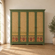 Herylosara Green 4 Door Cabinet shown with a shaped cornice, floral lower panels and green framing in a sunlit bedroom.