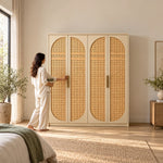 Hingimola Cream 4 Door Cane Wardrobe with a woman at the front of the wardrobe; cream door framing and a pale outer case.