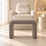 Hoksala Upholstered Pedicure Footrest, showing padded panel legs and rounded upper corners at a sunlit pedicure station.
