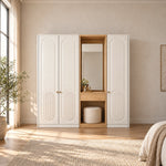 Kapilosa 3 Door Wardrobe with Dressing Mirror pairs small brass-tone pulls with white arch-panel doors in a sunlit bedroom.