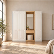 Kapilosa 3 Door Wardrobe with Dressing Mirror pairs small brass-tone pulls with white arch-panel doors in a sunlit bedroom.