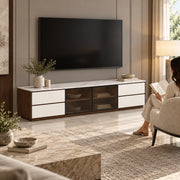 Labeliny White Marble Top TV Unit, a recessed base and white drawer fronts, with a woman beside the living room media wall.