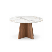 Linosola Marble Top 4-Seater Dining Table with a round veined surface over intersecting wood panels on a white background.