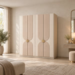 Lottomira 4 Door Wooden Wardrobe displays a four-door front together with curved panel detailing against a bedroom wall.