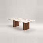 Mackilti Marble Top 6-Seater Dining Table, with two fluted panel legs and a long dining surface against a grey backdrop.