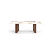 Mackilti Marble Top 6-Seater Dining Table: a long dining surface, a rectangular marble top and two fluted panel legs.